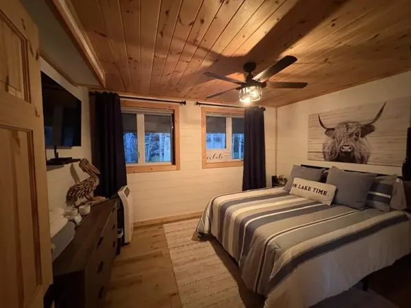 A wider view of the main floor bedroom